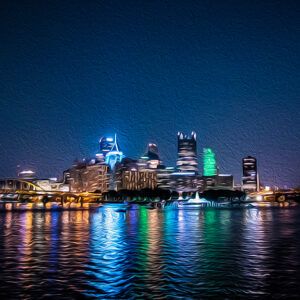 photograph of Pittsburgh at night with the reflection on water