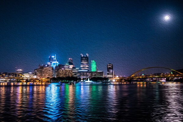 photograph of Pittsburgh at night with the reflection on water
